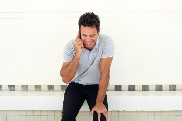 Handsome older man talking on mobile phone